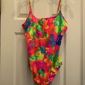 Ladies brightly colored 1 piece swimsuit with 2 flat beads on both straps.